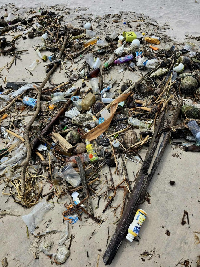 Plastic and fishing debris washed onto a beach in Thailand